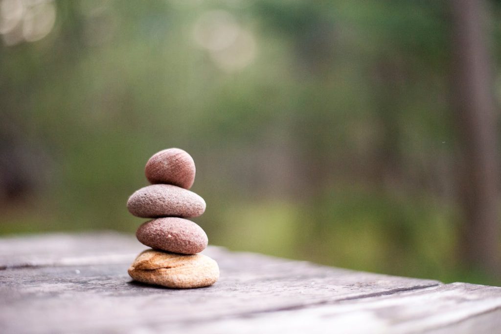 pexels-photo-668353 Balance and tranquility embodied by stacked stones in a natural outdoor setting.